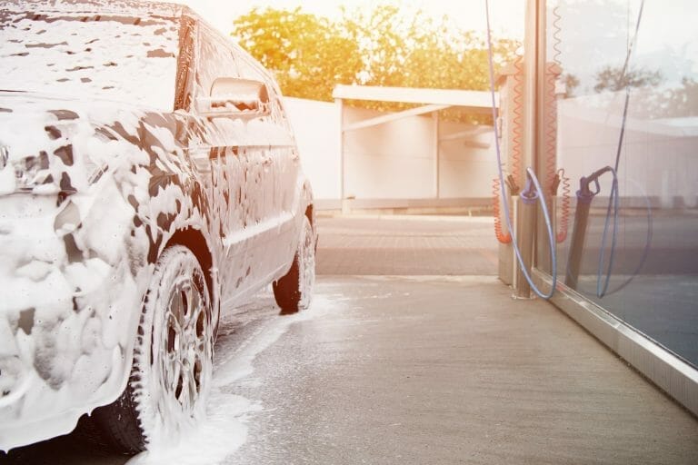 car being washed, sedan in bubble foam